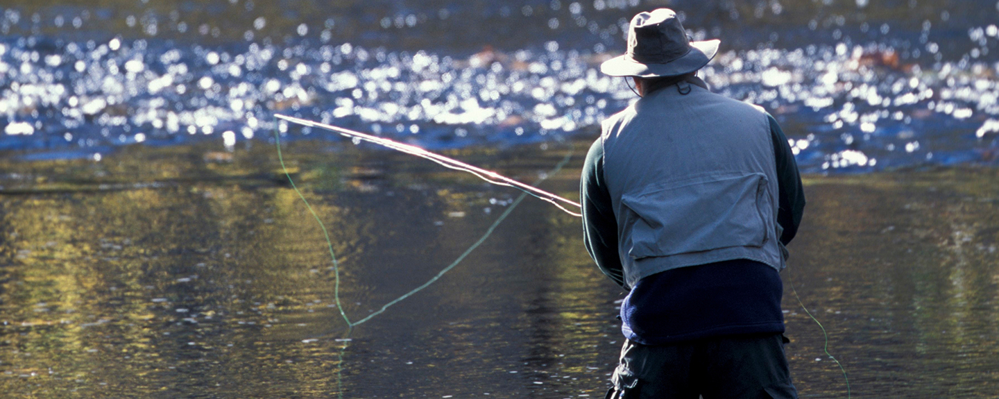 man fly fishing on the Lamprey River, photo by Jerry Monkman